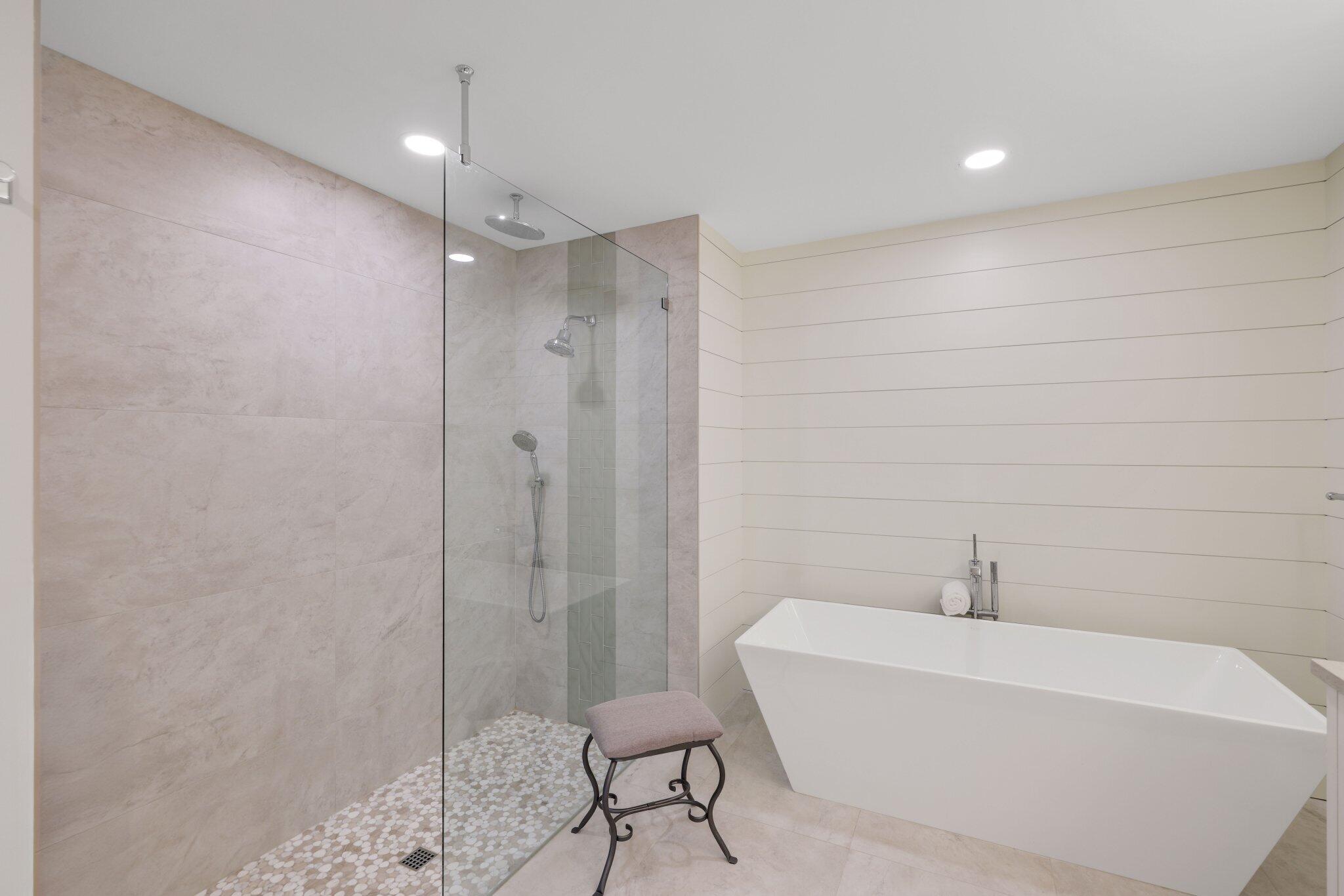215 Ridge Road Jupiter, FL 33477 - Photo 23 of 43 a bathroom with a bathtub and shower