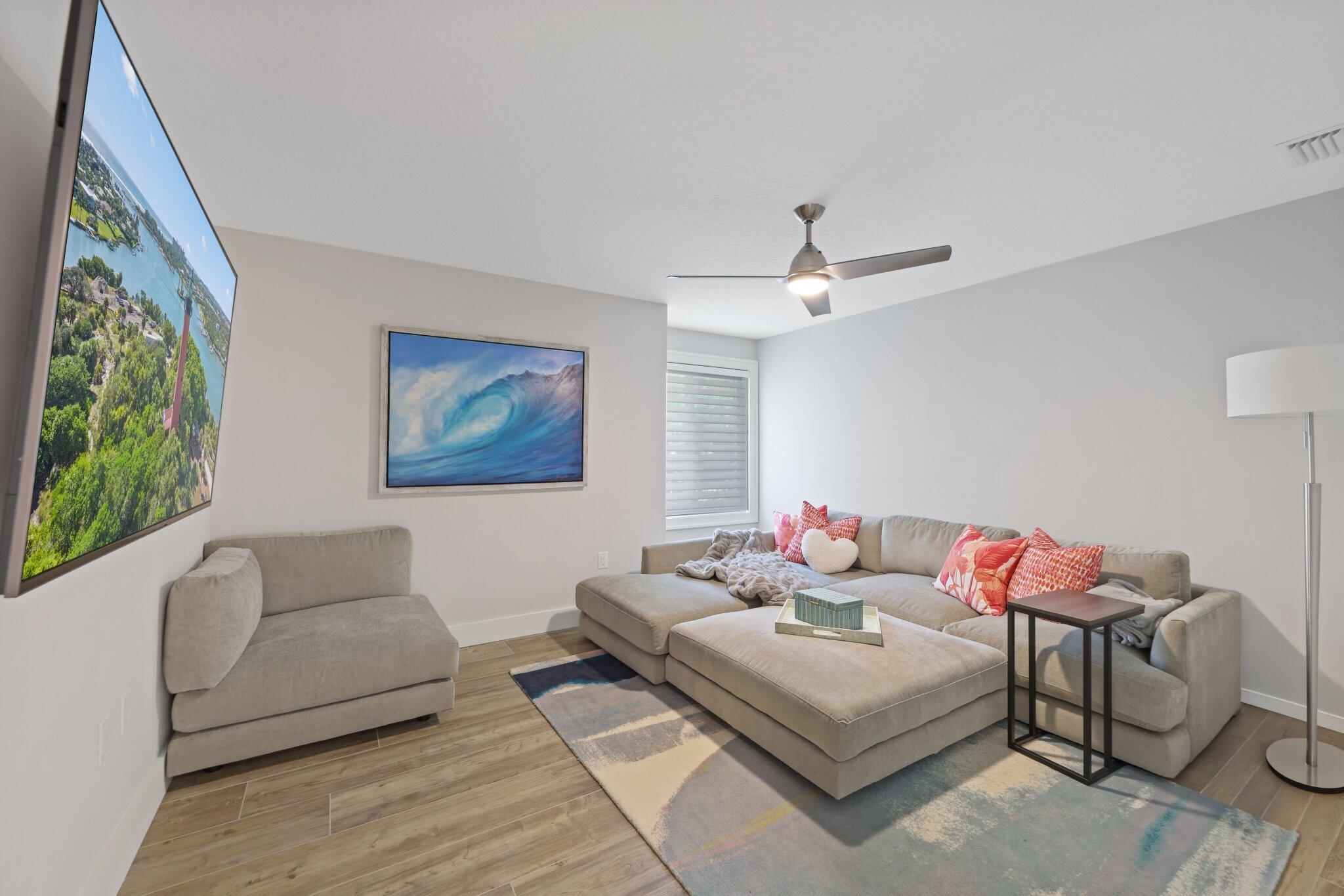 215 Ridge Road Jupiter, FL 33477 - Photo 24 of 43 a living room with furniture and a large window