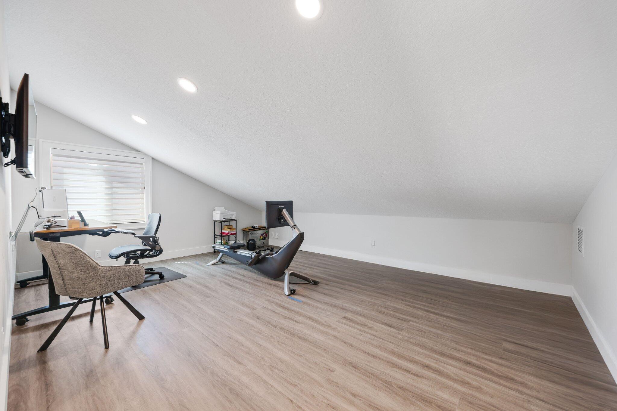 215 Ridge Road Jupiter, FL 33477 - Photo 32 of 43 a living room with furniture and a wooden floor