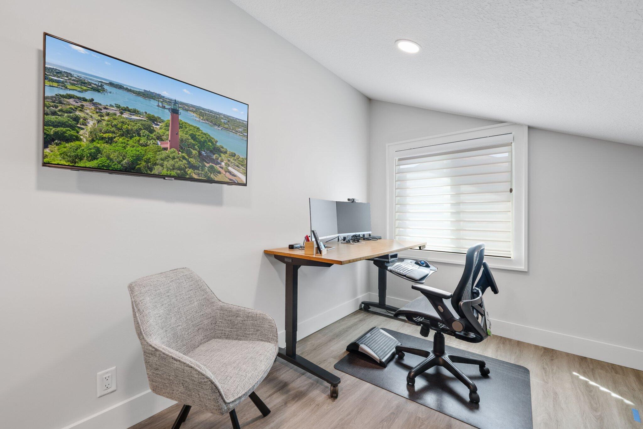 215 Ridge Road Jupiter, FL 33477 - Photo 33 of 43 a view of a workspace with furniture and a window