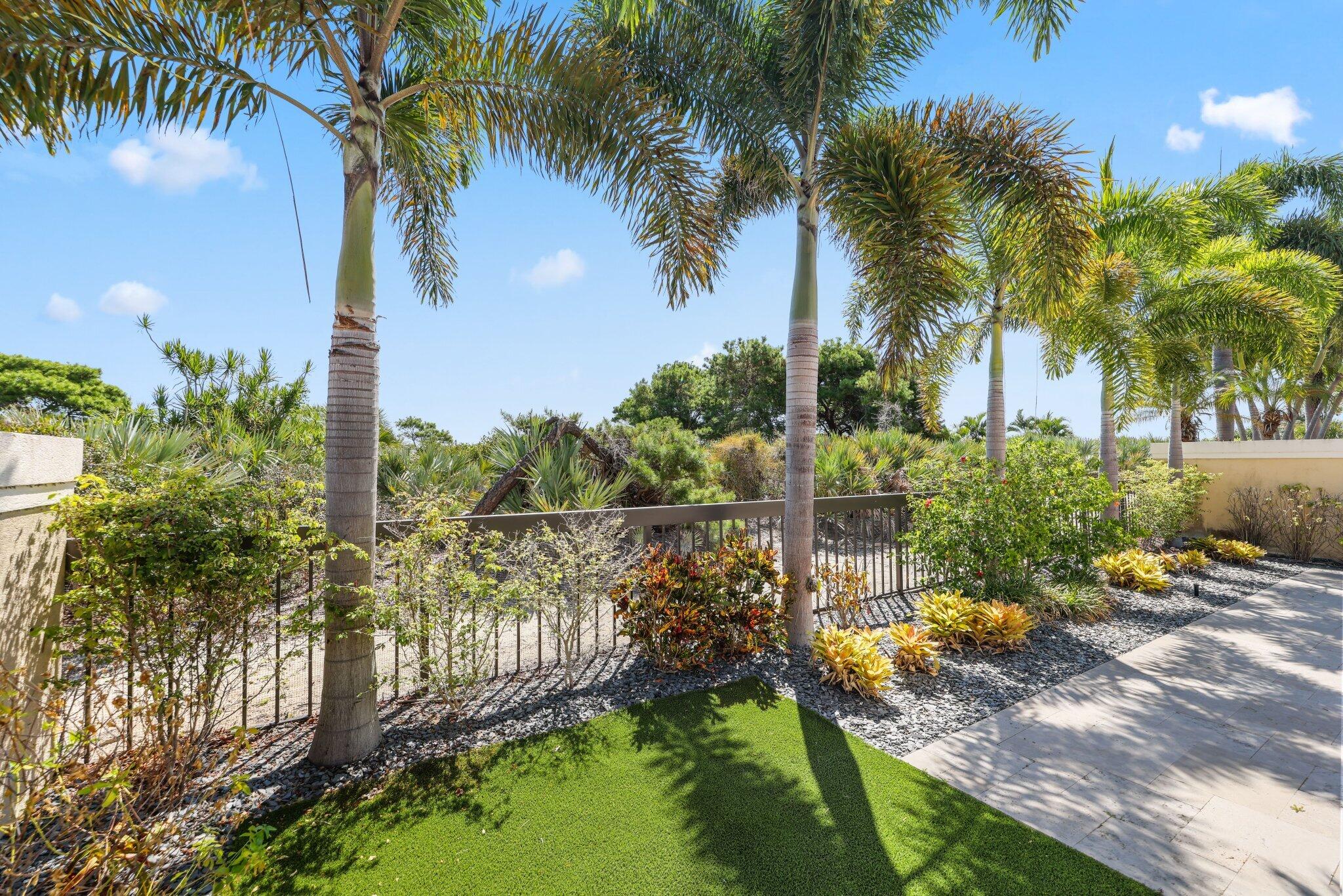 215 Ridge Road Jupiter, FL 33477 - Photo 38 of 43 a view of a yard and palm trees