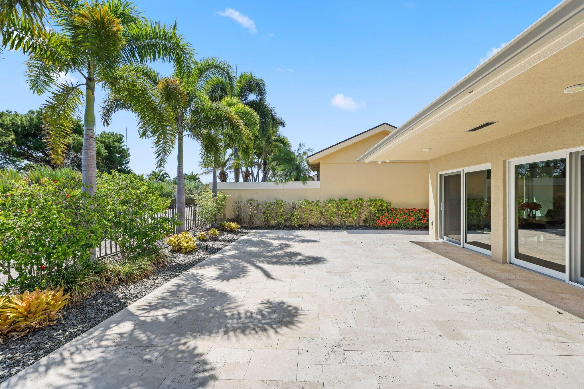 215 Ridge Road Jupiter, FL 33477 - Photo 39 of 43 a view of a yard with potted plants