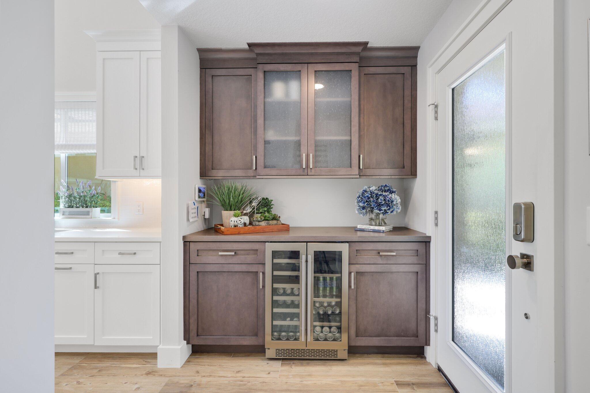 215 Ridge Road Jupiter, FL 33477 - Photo 8 of 43 a kitchen with stainless steel appliances granite countertop a stove and a refrigerator