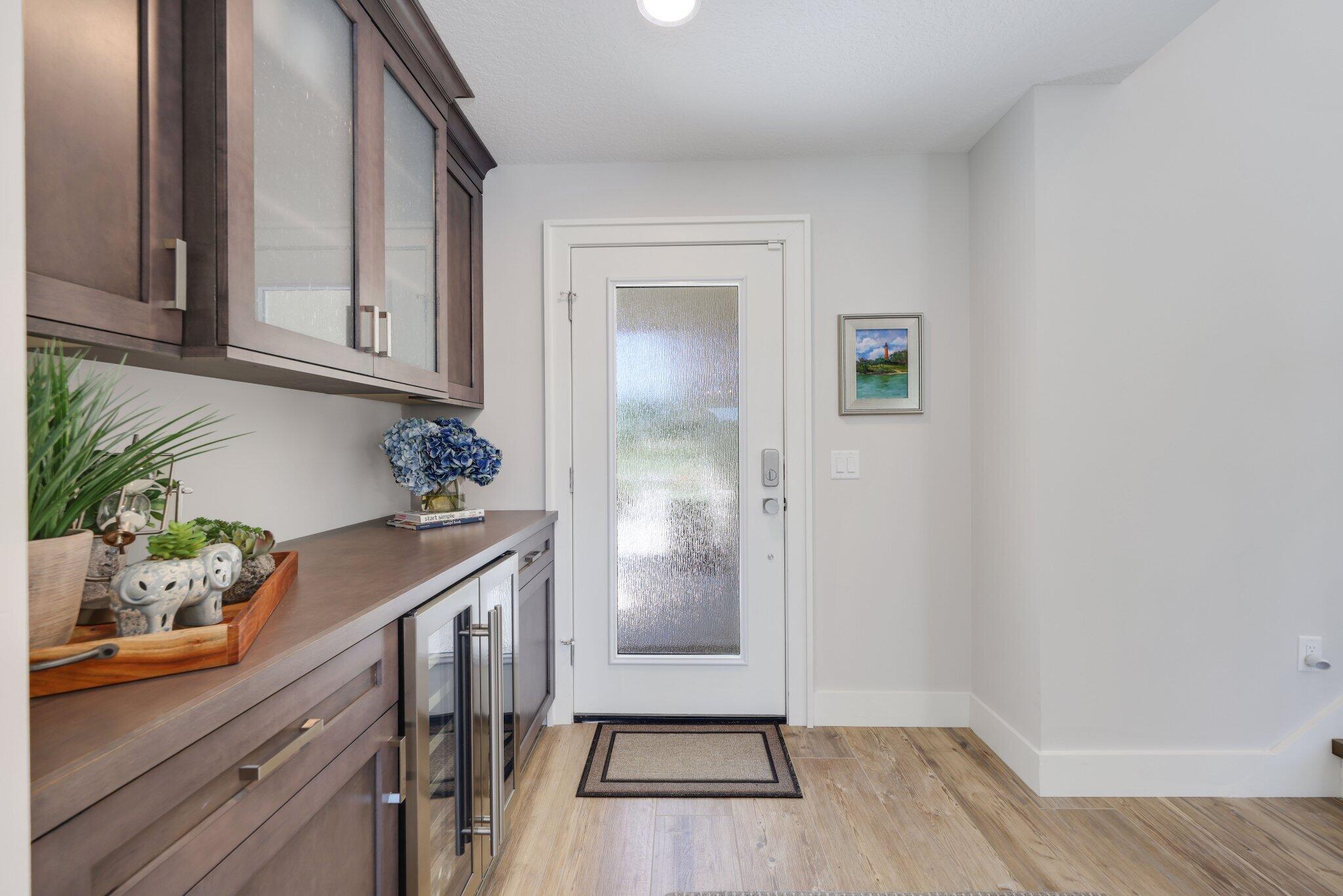 215 Ridge Road Jupiter, FL 33477 - Photo 9 of 43 a view of kitchen with furniture and wooden floor