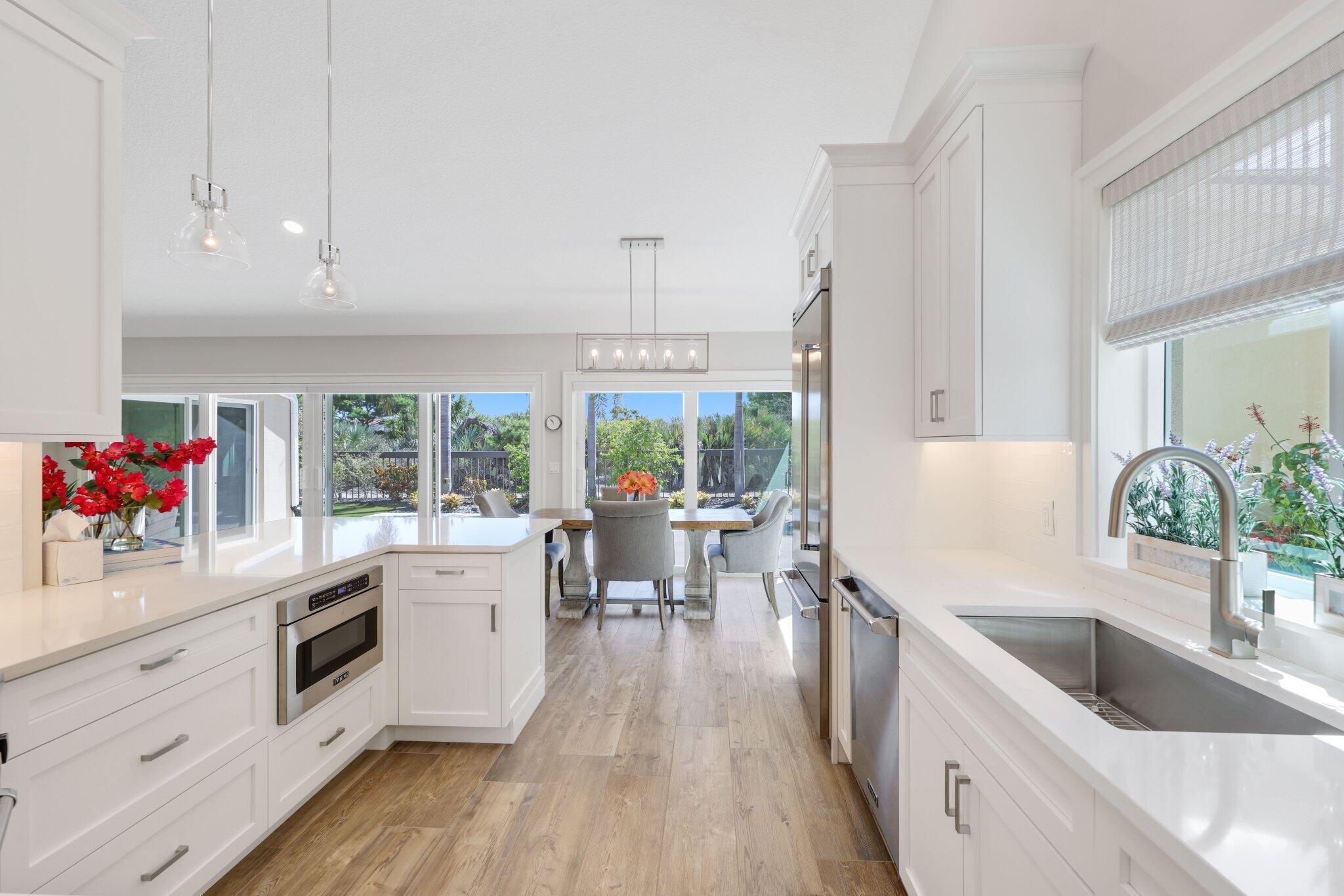 215 Ridge Road Jupiter, FL 33477 - Photo 10 of 43 a large kitchen with a lot of counter space