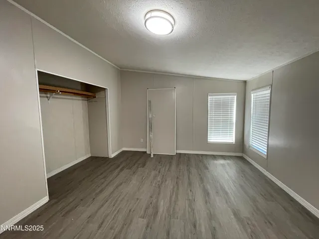 a view of balcony with wooden floor and fence