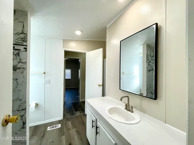 a bathroom with a bathtub and sink