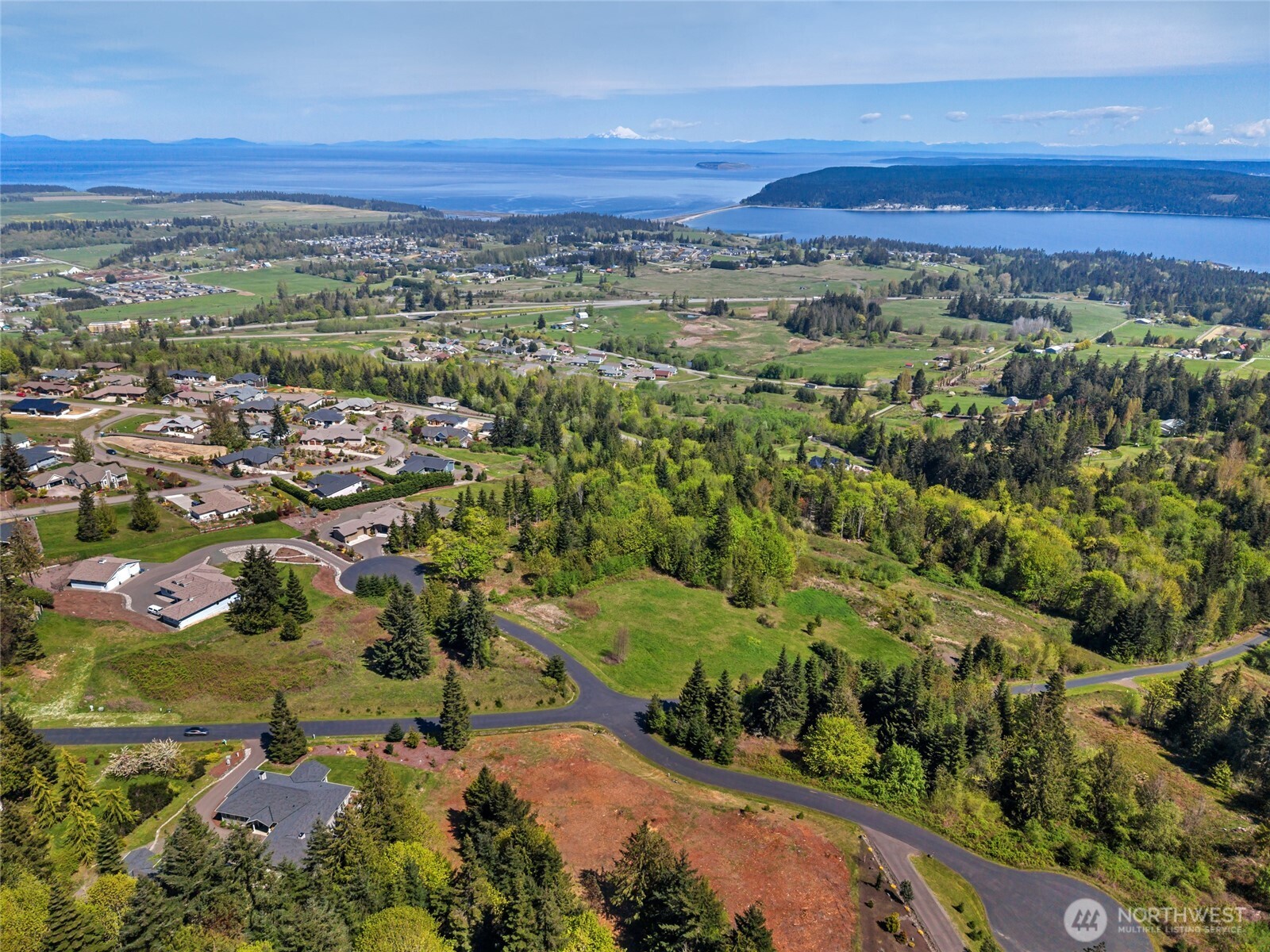 15 High Vw Way Sequim, WA 98382 - Photo 9 of 17 an aerial view of a city and mountain view in back