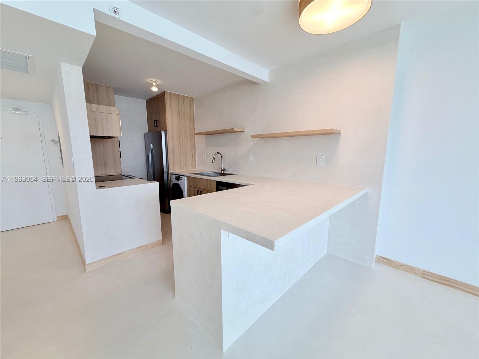 a utility room with washer and dryer