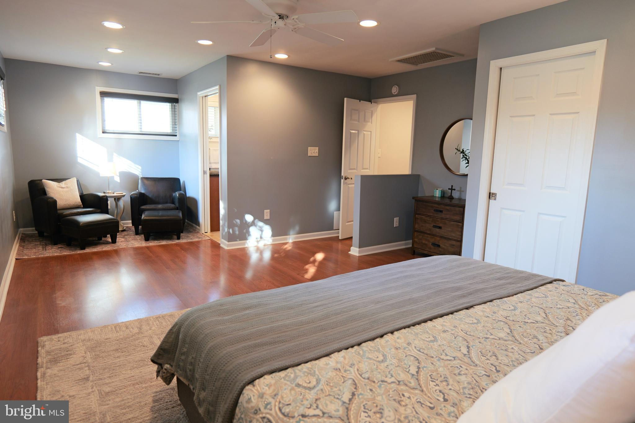 7323 Inzer Street Springfield, VA 22151 - Photo 15 of 25 a bedroom with a bed and a dresser