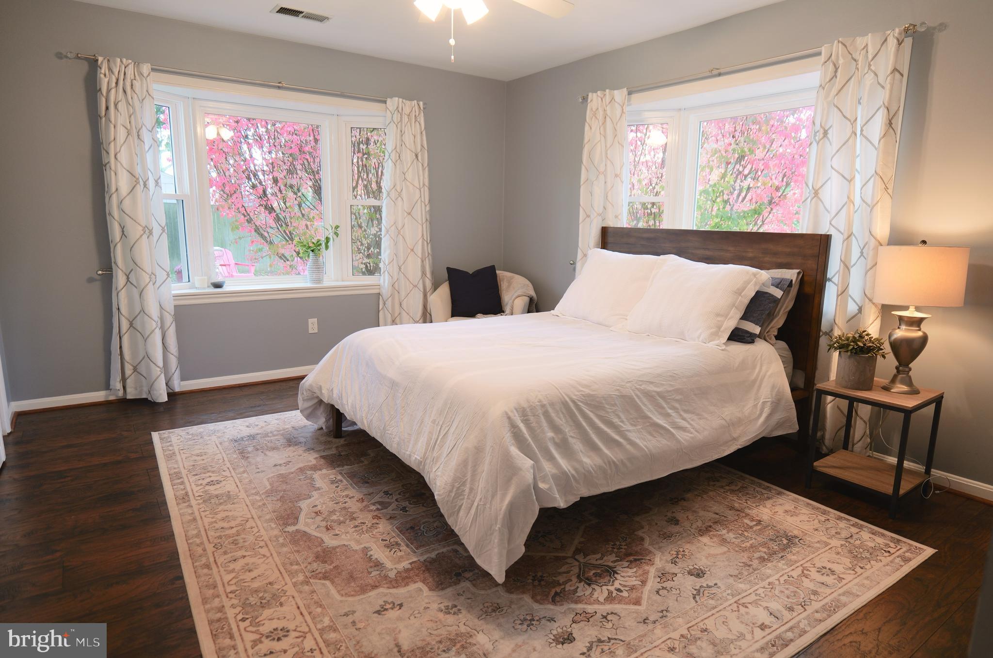 7323 Inzer Street Springfield, VA 22151 - Photo 21 of 25 a large bed sitting in a bedroom next to a window