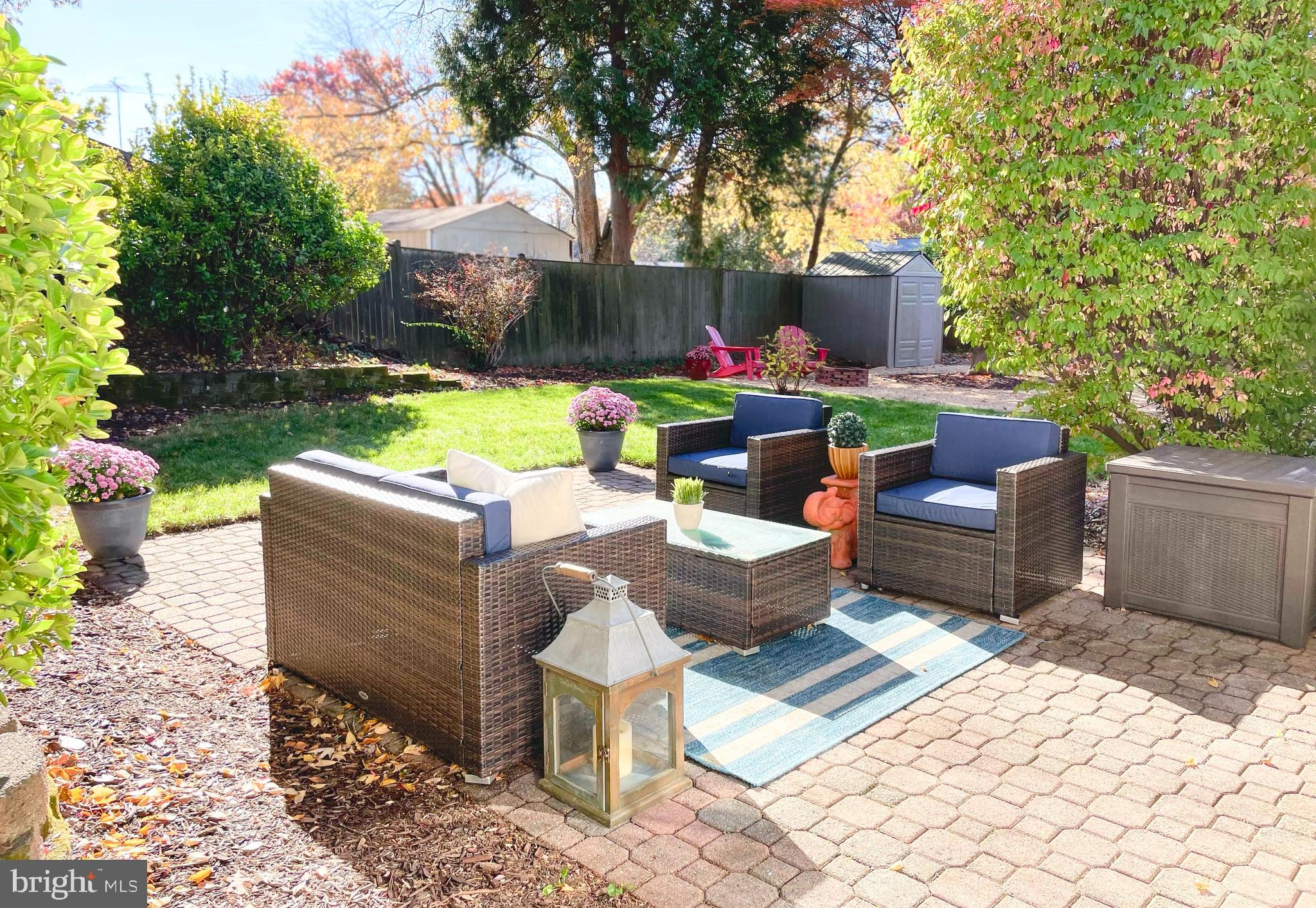 7323 Inzer Street Springfield, VA 22151 - Photo 25 of 25 a view of a patio with table and chairs potted plants and a large tree