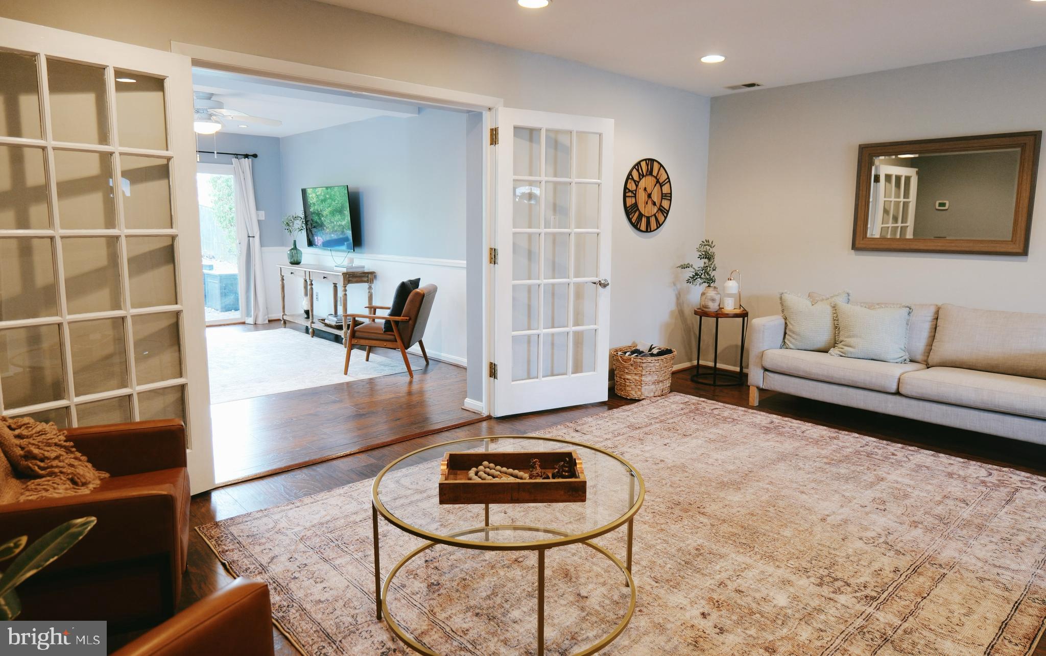 7323 Inzer Street Springfield, VA 22151 - Photo 10 of 25 a living room with furniture and a rug