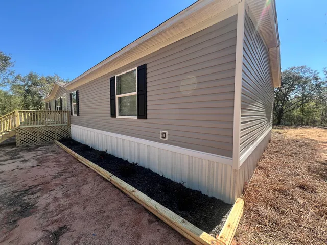 a view of a back yard of the house