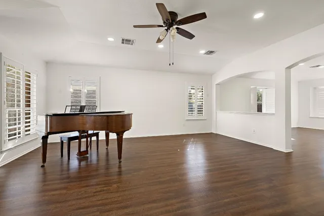 a view of a dining room with furniture and wooden floor