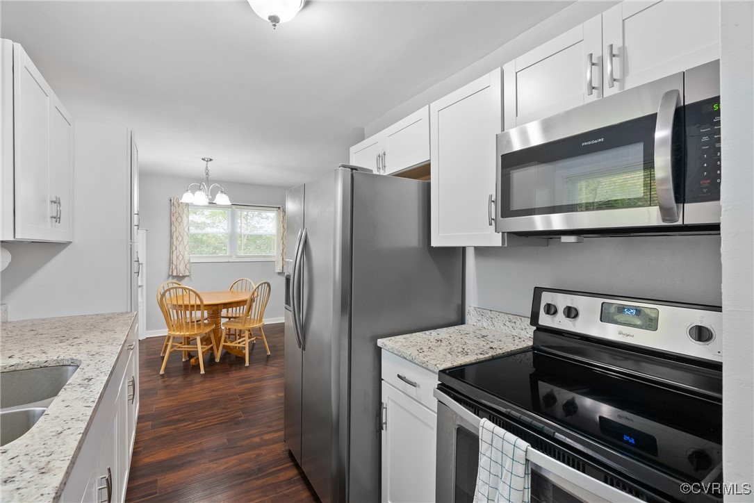 4660 Marks Lane Goochland, VA 23063 - Photo 13 of 39 a kitchen with stainless steel appliances granite countertop a stove microwave and sink