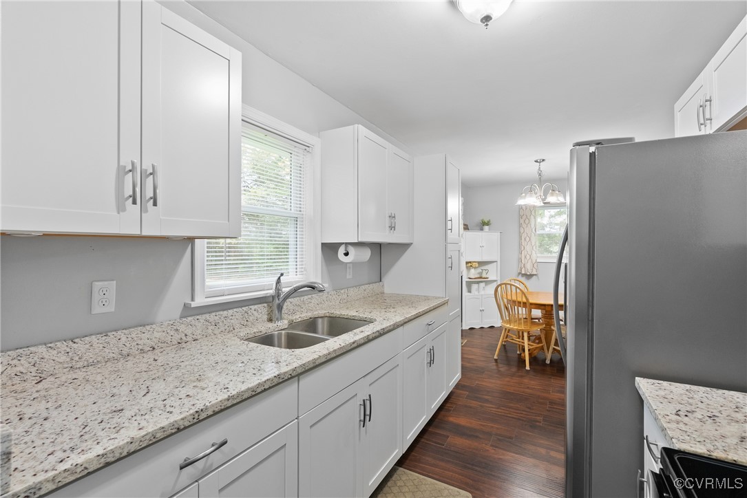 4660 Marks Lane Goochland, VA 23063 - Photo 14 of 39 a kitchen with granite countertop a sink a counter space and cabinets