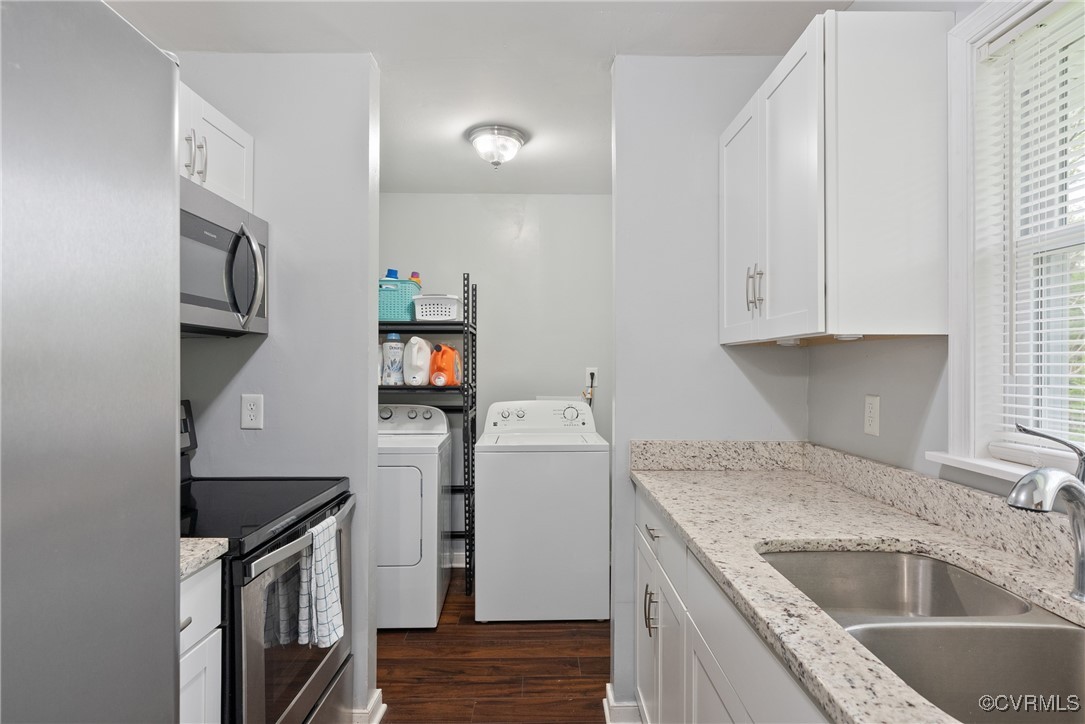 4660 Marks Lane Goochland, VA 23063 - Photo 16 of 39 a kitchen with a sink a stove and a refrigerator