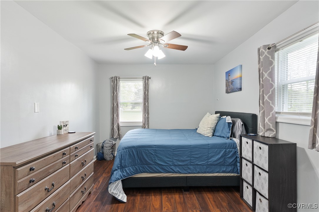 4660 Marks Lane Goochland, VA 23063 - Photo 21 of 39 a bedroom with a bed and a chandelier