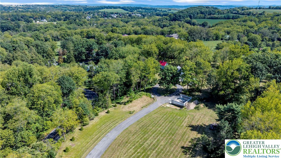 384 Henry Road Nazareth, PA 18064 - Photo 15 of 54 Lush rolling hills and mature trees frame this expansive property with scenic countryside views.