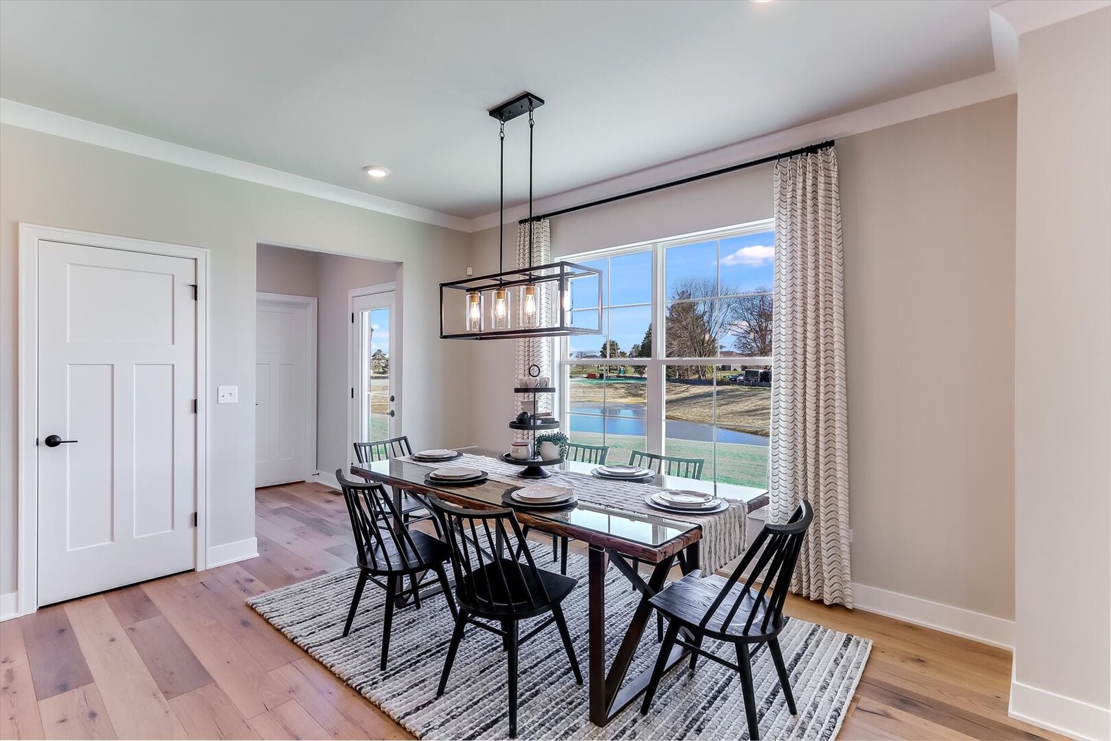 10854 Saxony Street Huntley, IL 60142 - Photo 11 of 30 a view of a dining room with furniture window and wooden floor