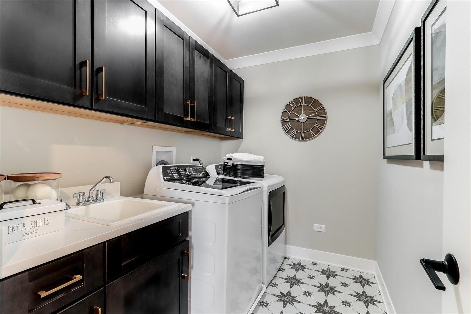 10854 Saxony Street Huntley, IL 60142 - Photo 30 of 30 a kitchen with stainless steel appliances a sink a stove and a refrigerator with wooden floor