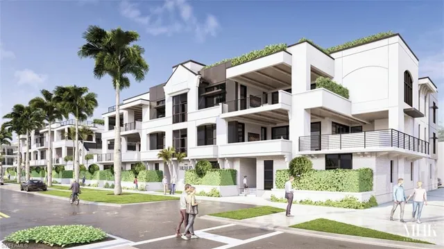 a view of a building with a yard and plants