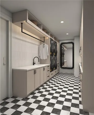 a kitchen with a checkered floor and white cabinets