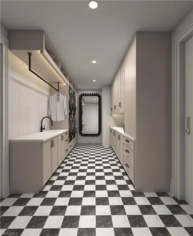 a room with a checkered floor and white kitchen with a sink