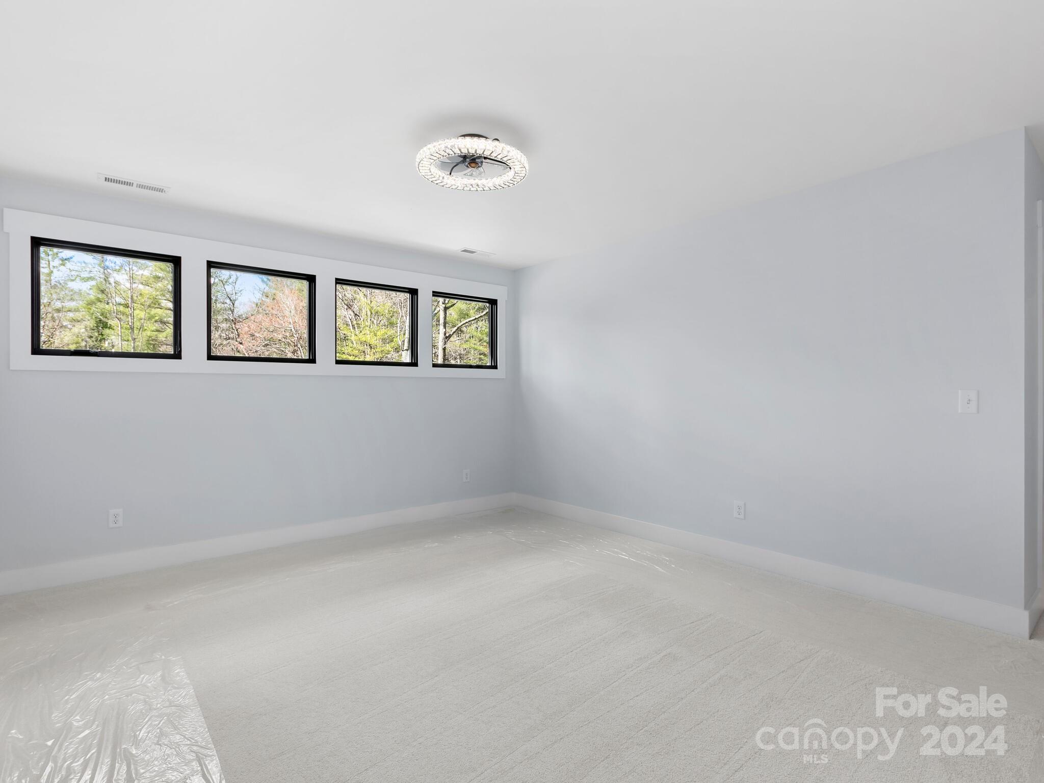 70 Reta Road Fairview, NC 28730 - Photo 14 of 22 an empty room with windows