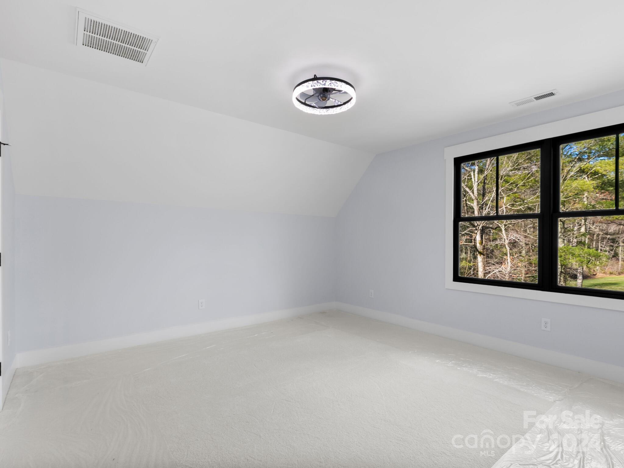 70 Reta Road Fairview, NC 28730 - Photo 17 of 22 an empty room with windows