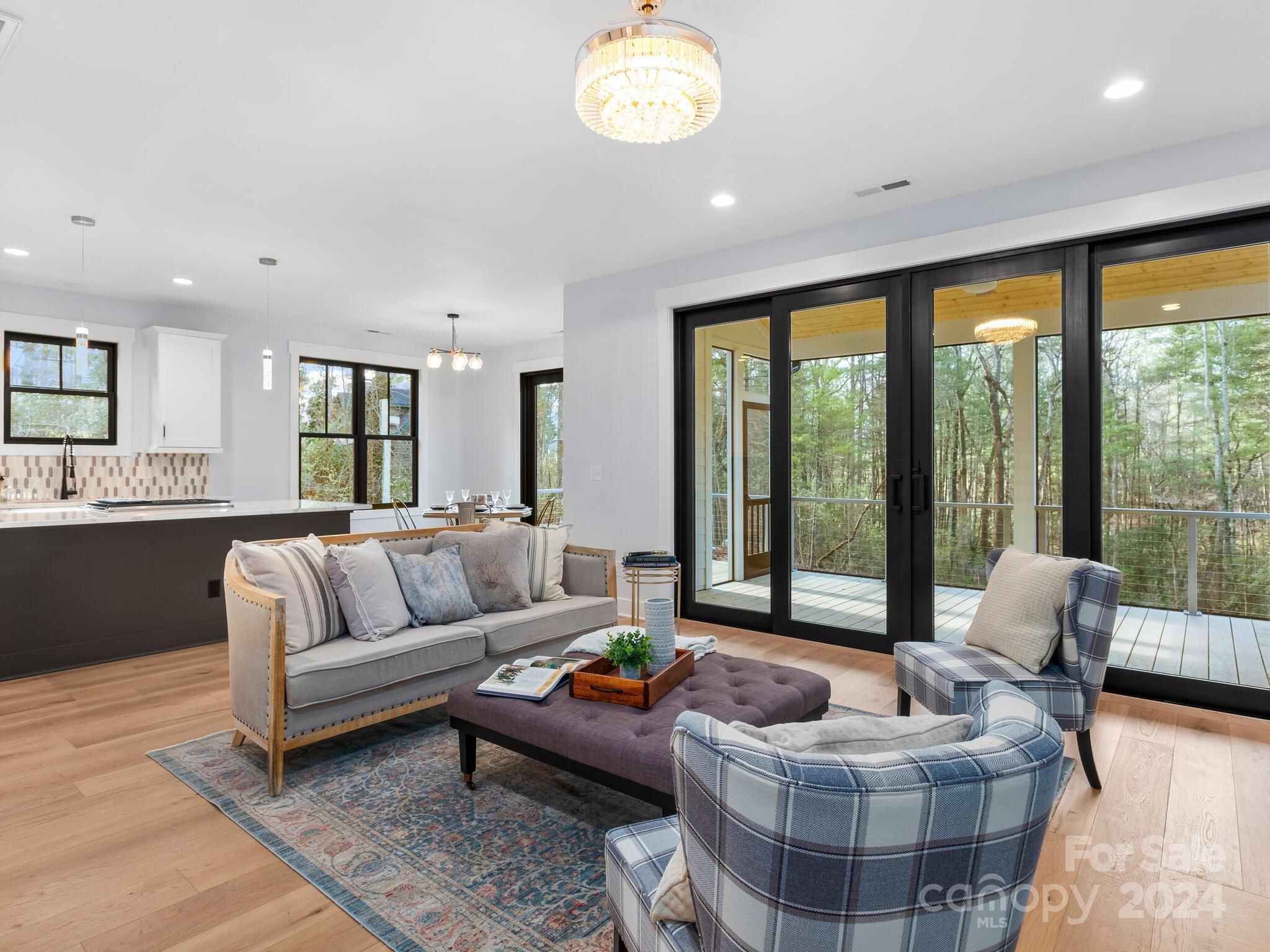 70 Reta Road Fairview, NC 28730 - Photo 3 of 22 a living room with furniture and a large window
