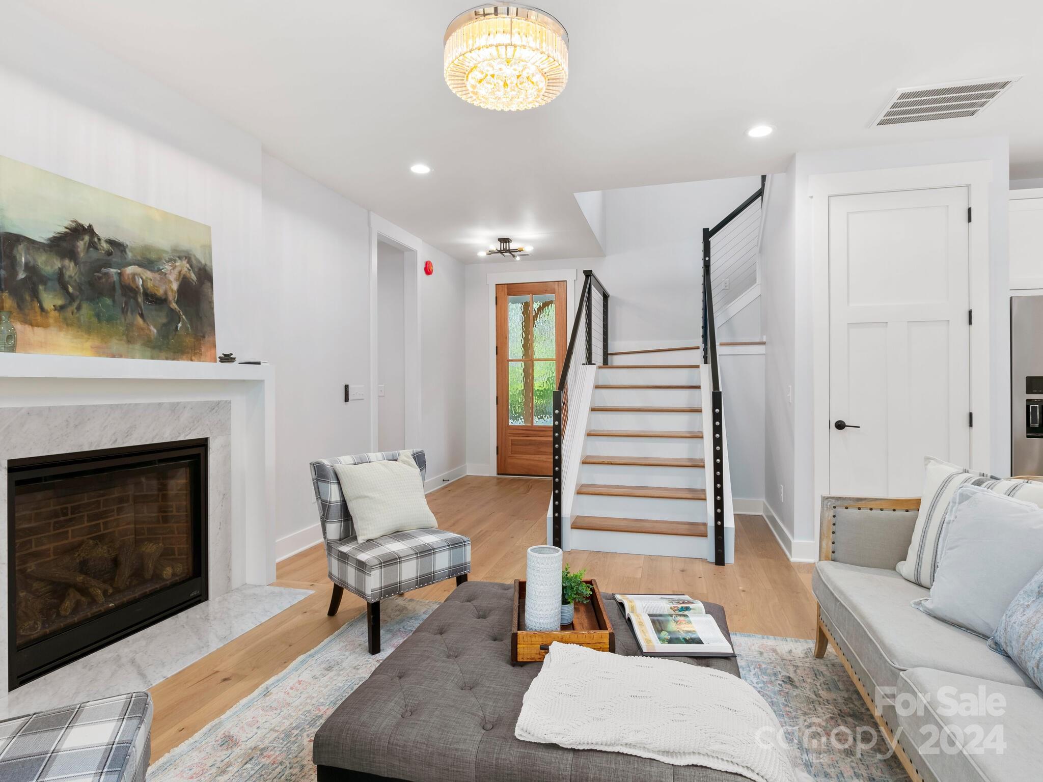 70 Reta Road Fairview, NC 28730 - Photo 5 of 22 a living room with furniture and a fireplace