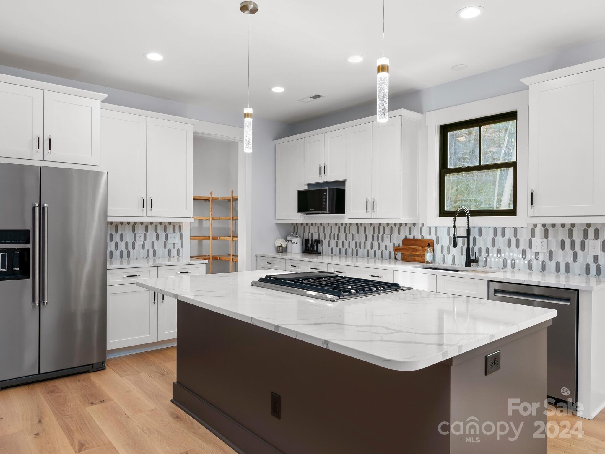70 Reta Road Fairview, NC 28730 - Photo 6 of 22 a kitchen with a sink stove top oven and refrigerator