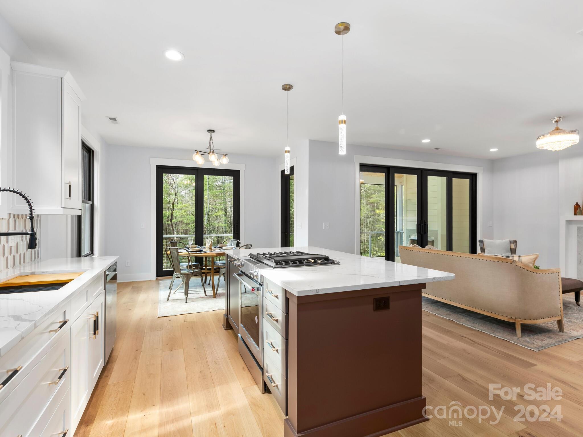 70 Reta Road Fairview, NC 28730 - Photo 7 of 22 a large white kitchen with a large window
