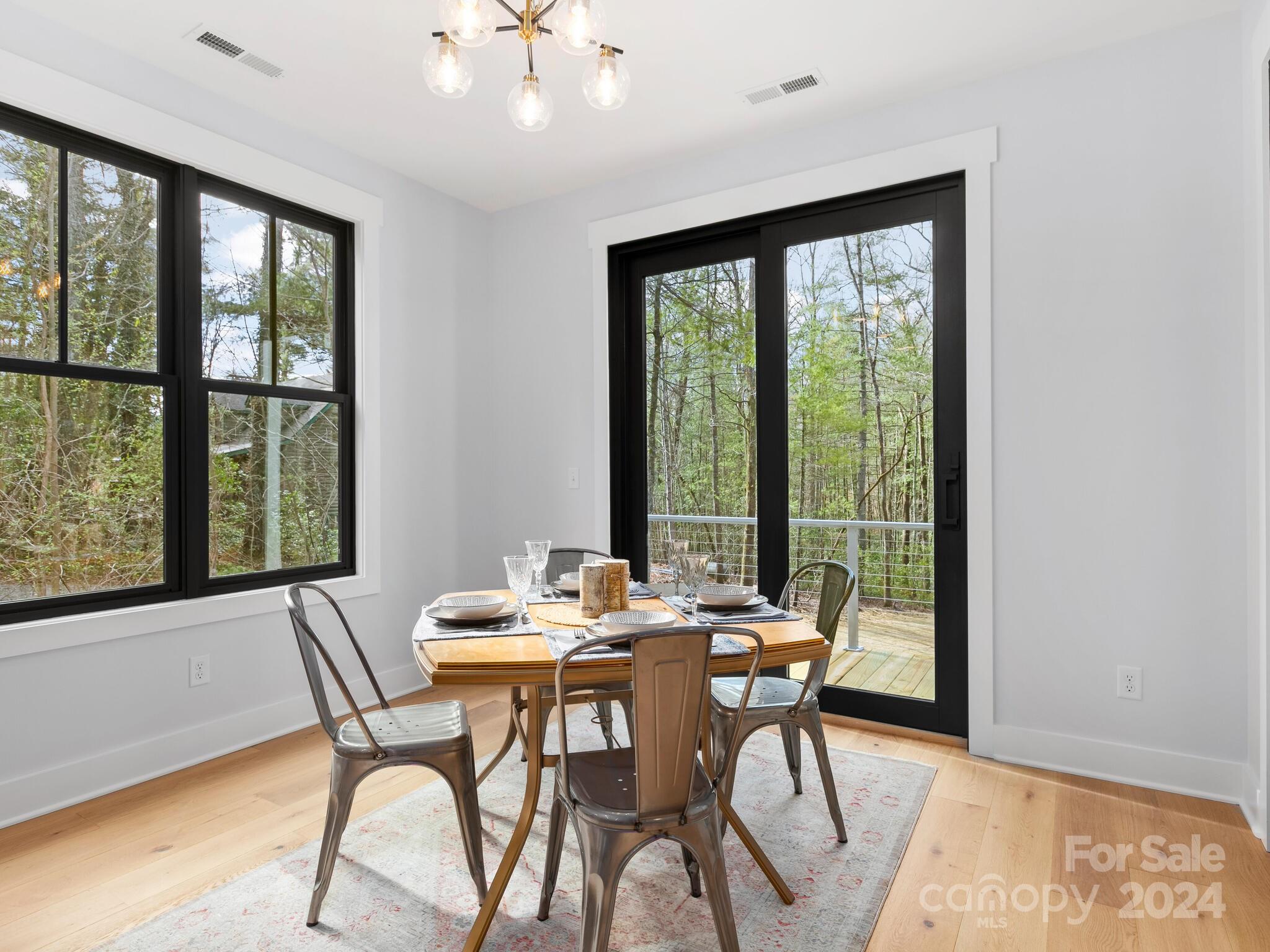 70 Reta Road Fairview, NC 28730 - Photo 8 of 22 a dining room with furniture and window