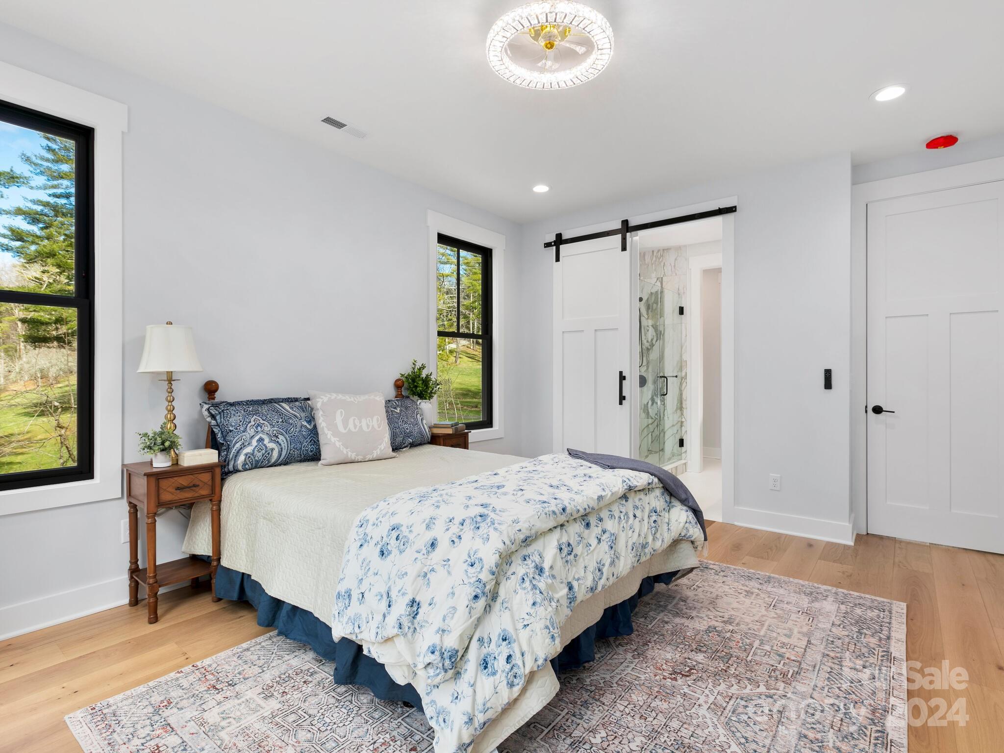 70 Reta Road Fairview, NC 28730 - Photo 10 of 22 a bedroom with a bed and a window