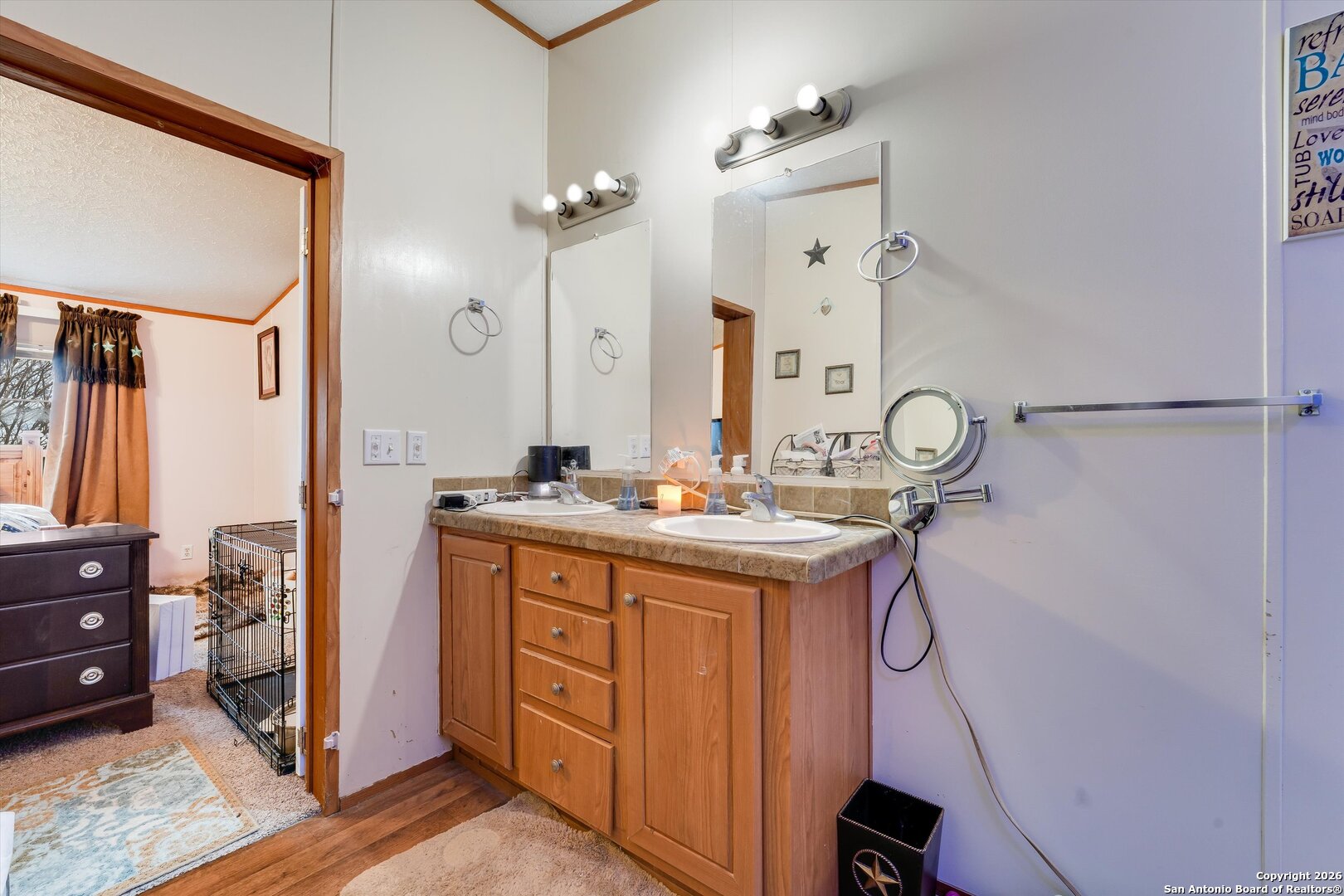 2760 Pioneer Road Seguin, TX 78155 - Photo 22 of 31 a bathroom with a granite countertop sink a mirror and a shower