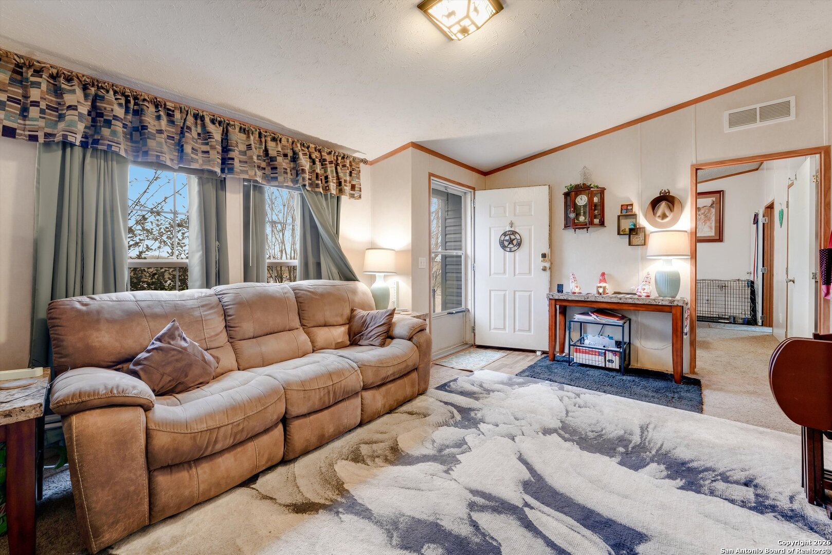 2760 Pioneer Road Seguin, TX 78155 - Photo 8 of 31 a living room with furniture and a flat screen tv