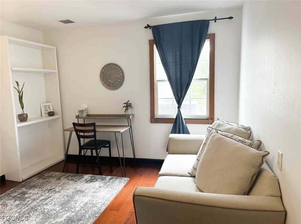6343 Mark Lane Fort Myers, FL 33966 - Photo 23 of 37 a living room with furniture and a window