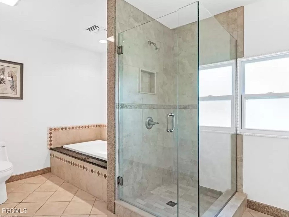 6343 Mark Lane Fort Myers, FL 33966 - Photo 30 of 37 a bathroom with a shower and bathtub