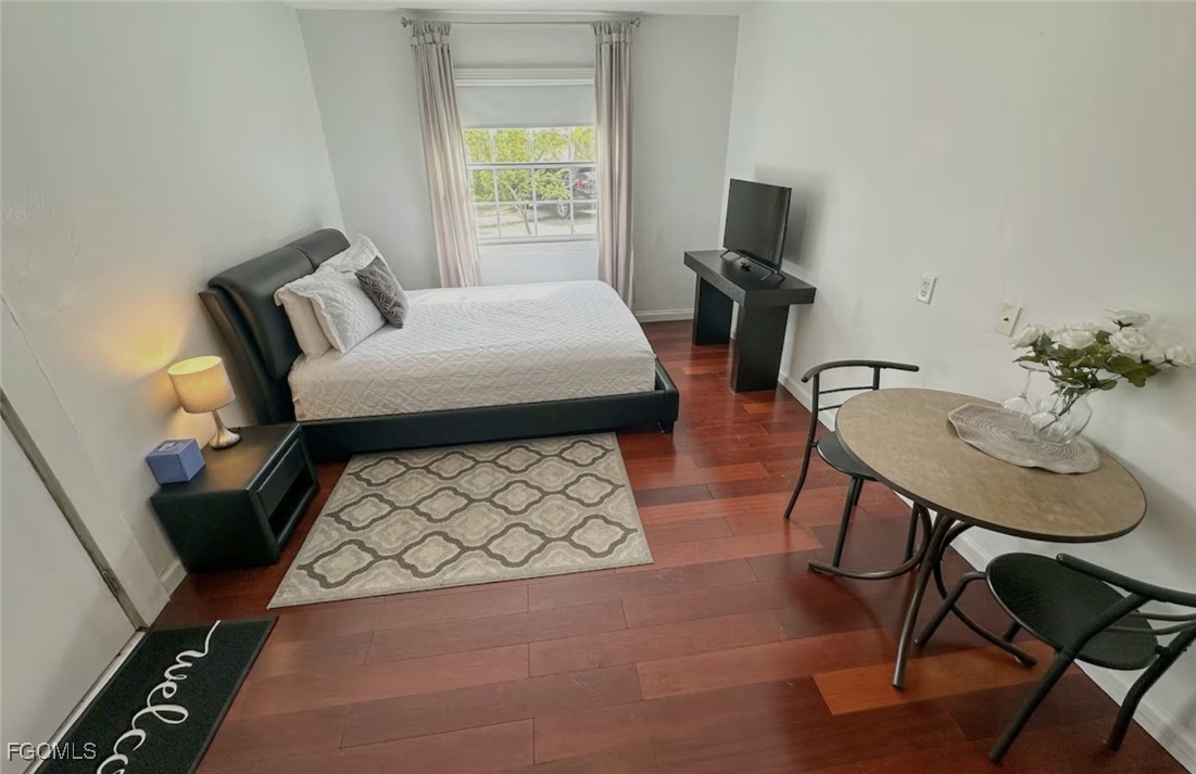 6343 Mark Lane Fort Myers, FL 33966 - Photo 33 of 37 a bed room with furniture and a window