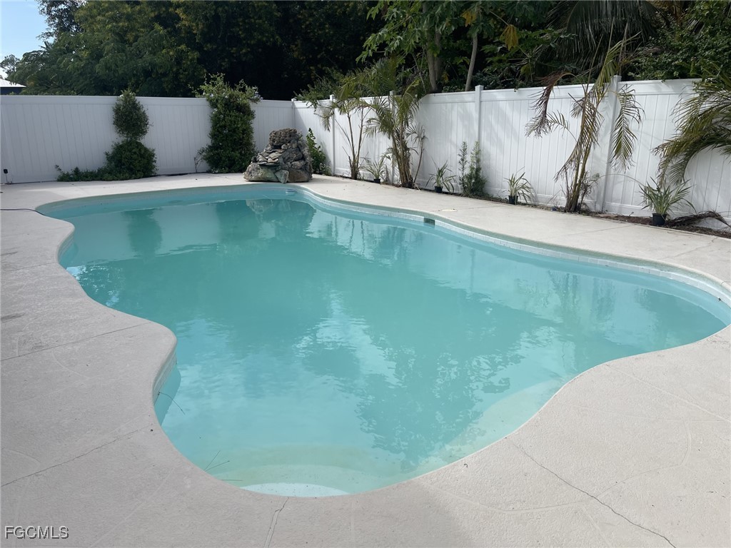 6343 Mark Lane Fort Myers, FL 33966 - Photo 35 of 37 a view of a swimming pool with an outdoor seating