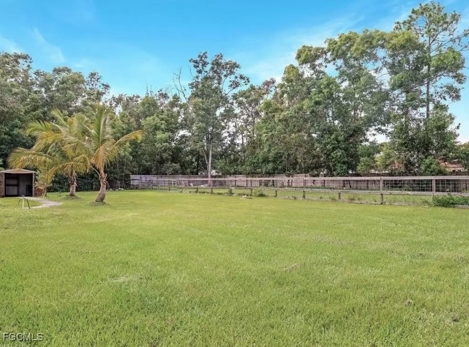 6343 Mark Lane Fort Myers, FL 33966 - Photo 37 of 37 a view of a yard with a large trees