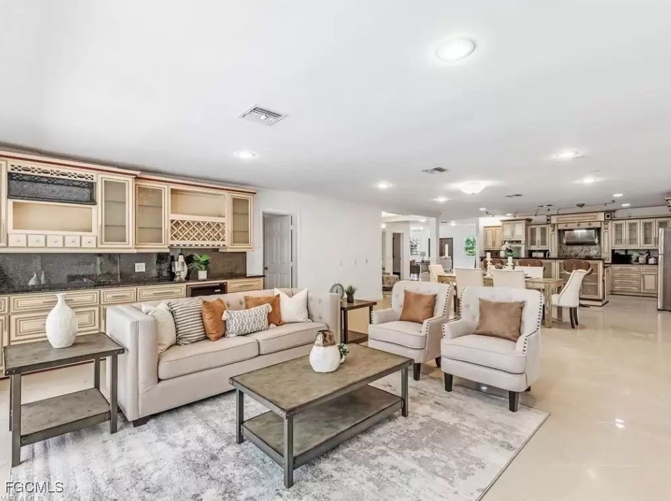 6343 Mark Lane Fort Myers, FL 33966 - Photo 4 of 37 a living room with furniture and a large window