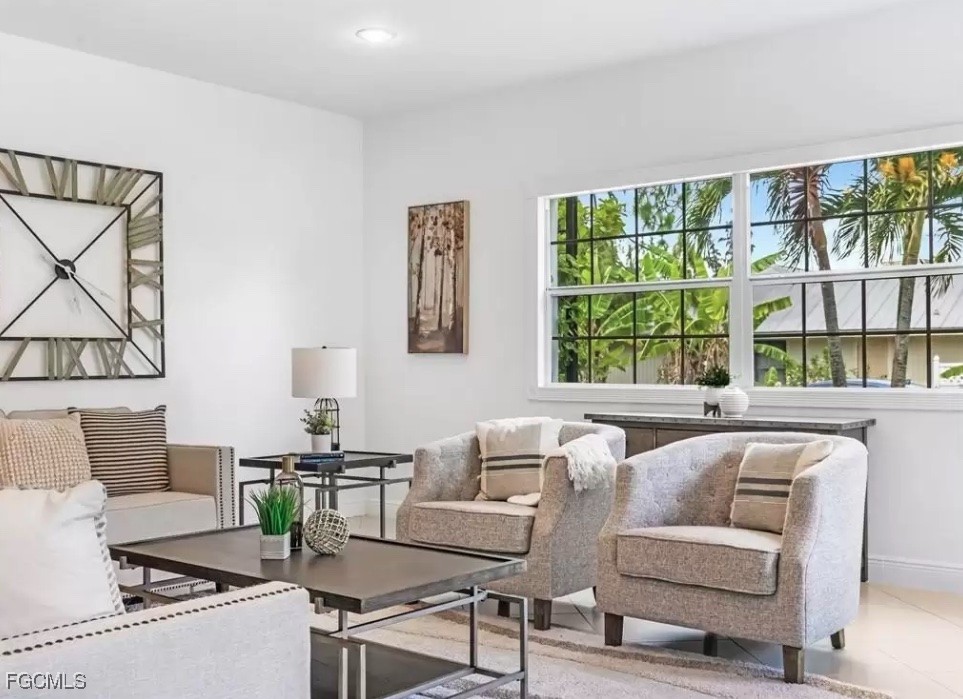 6343 Mark Lane Fort Myers, FL 33966 - Photo 5 of 37 a living room with furniture and a large window