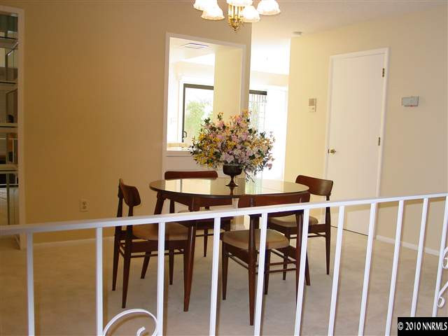 1451 Foster Drive Reno, NV 89509 - Photo 3 of 13 a view of a dining room with furniture window and wooden floor