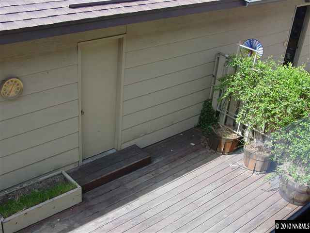 1451 Foster Drive Reno, NV 89509 - Photo 9 of 13 a wooden bench sitting in front of a window