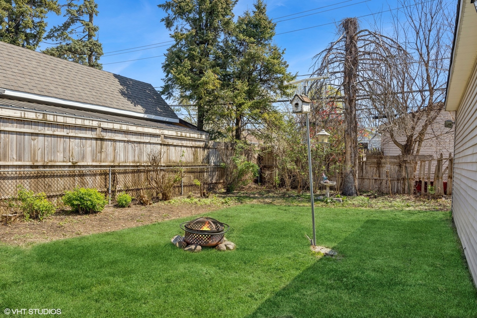 1315 Webster Lane Des Plaines, IL 60018 - Photo 15 of 18 a view of a chair and table in backyard of the house
