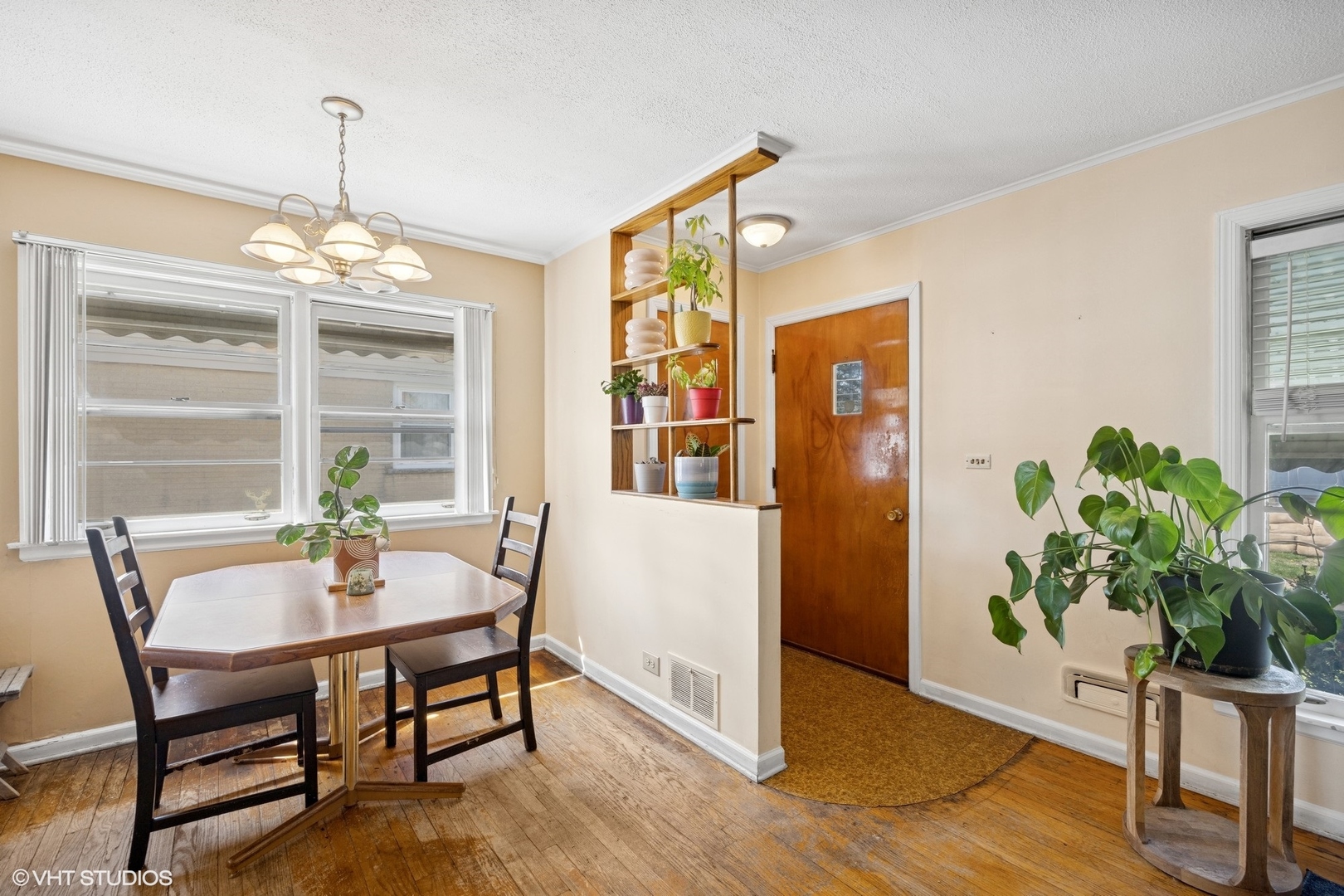1315 Webster Lane Des Plaines, IL 60018 - Photo 2 of 18 a dining room with furniture potted plants and wooden floor